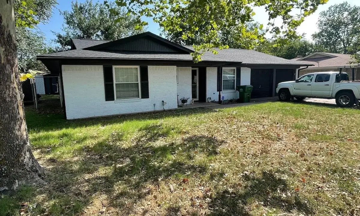 Professional roofing crew working on a residential roof in Kennebunk